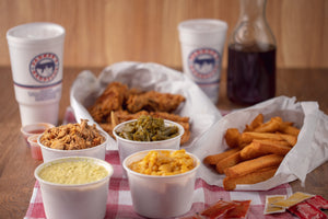 Southern Style Eastern NC BBQ, Cole Slaw, Mac-n-Cheese, Green Beans, and hushpuppies on table