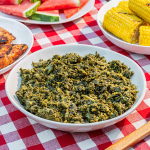 Parker's collard greens with grilled corn and watermelon on a checkered tablecloth
