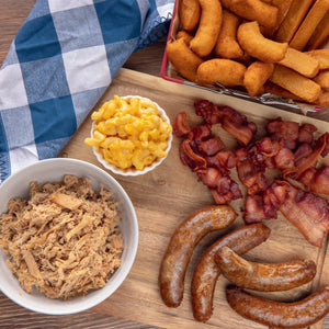 Parker's BBQ Mail Order service. Our Parker's Ultimate Gift Box includes 2lbs BBQ ,1lb bacon, 1Lbs of Sausage links, cornsticks, Hushpuppies, 2lbs of Mac & Cheese and Parkers BBQ signature Vinegar Sauce